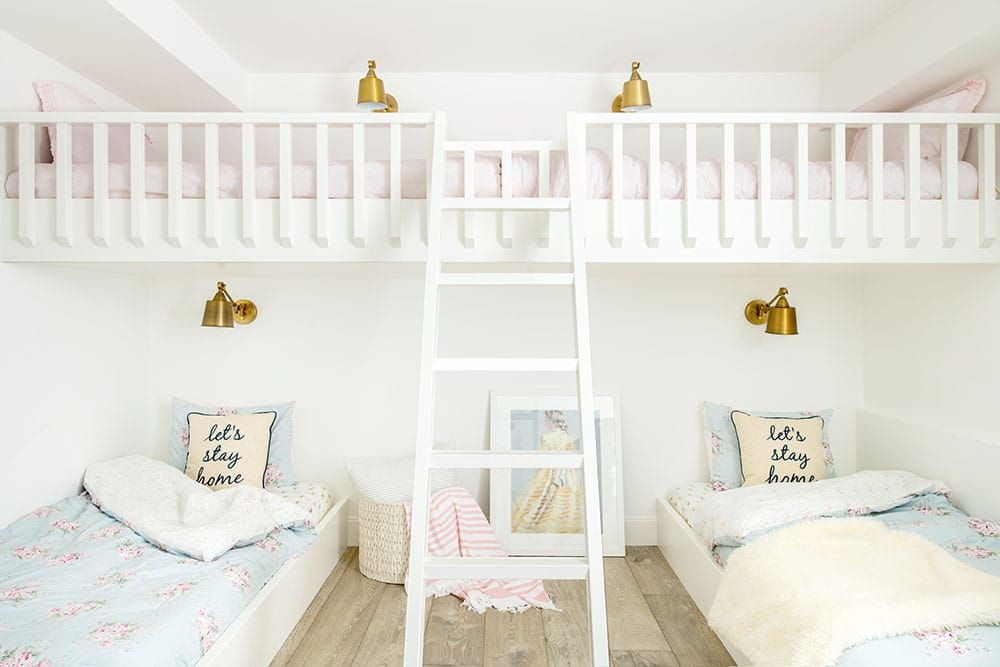 Bunk bed playroom with brass sconces