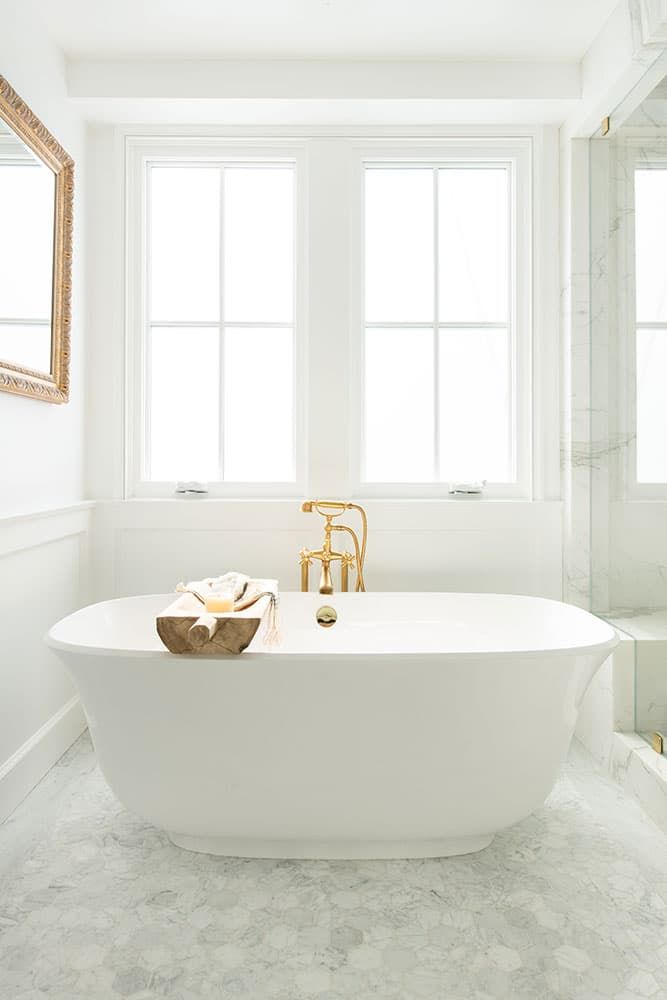 White primary bath with freestanding tub