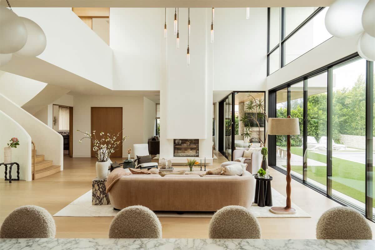 Double-height living room with floor to ceiling glass