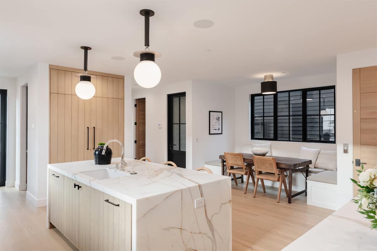 White kitchen with marble island